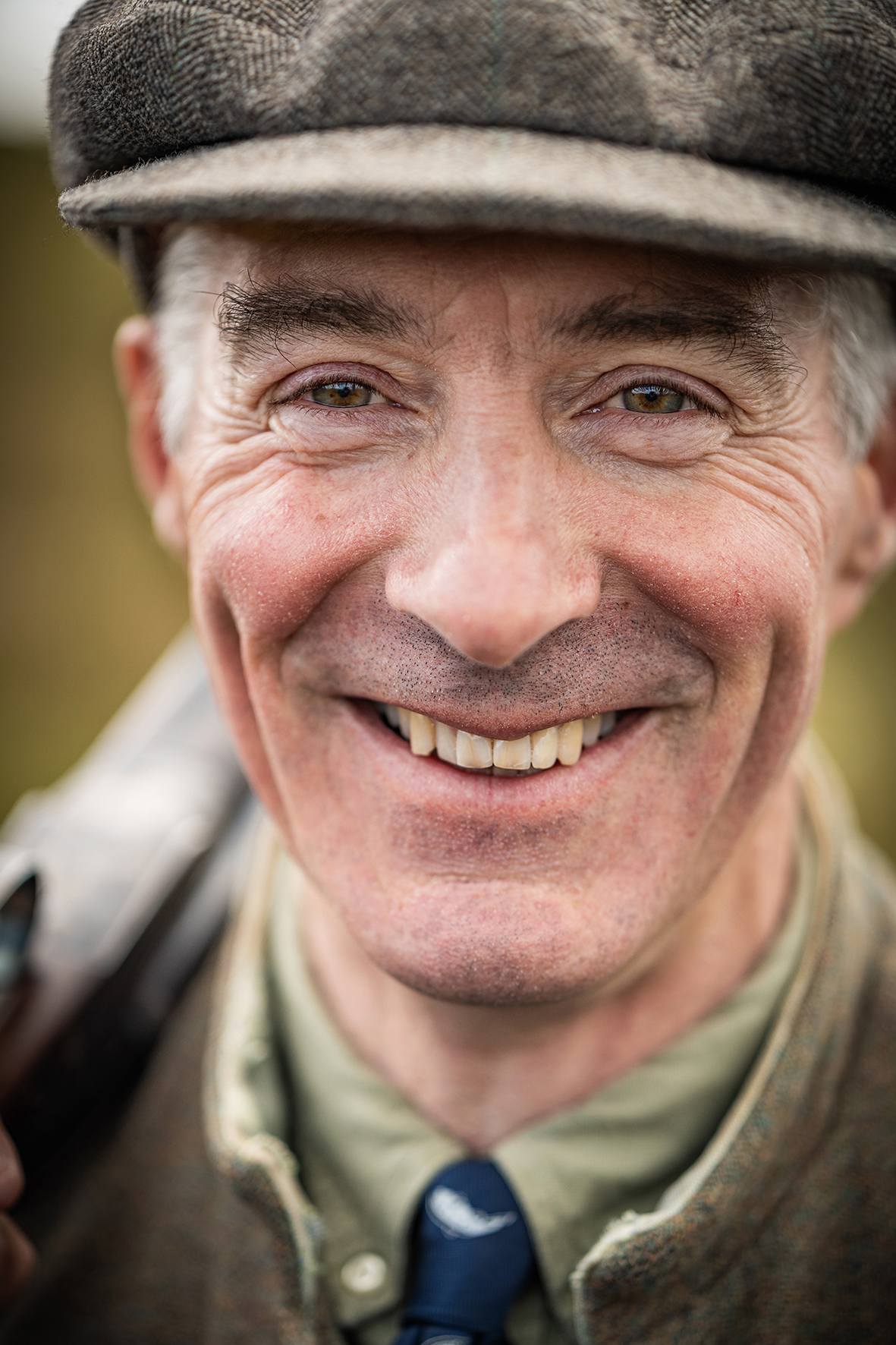 Close-up portrait of Robbie Douglas-Miller smiling in traditional fieldsports attire